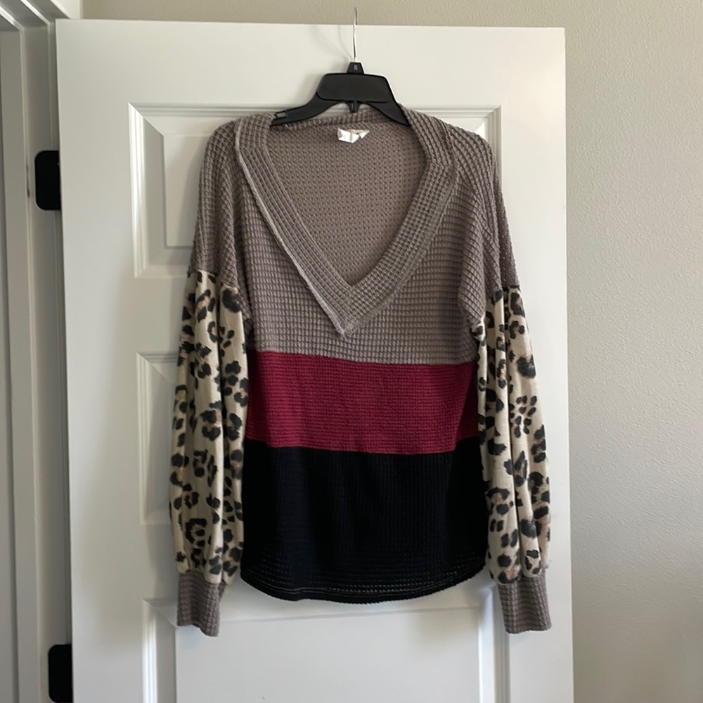 Long sleeve shirt. Size S. Runs large.  Boutique